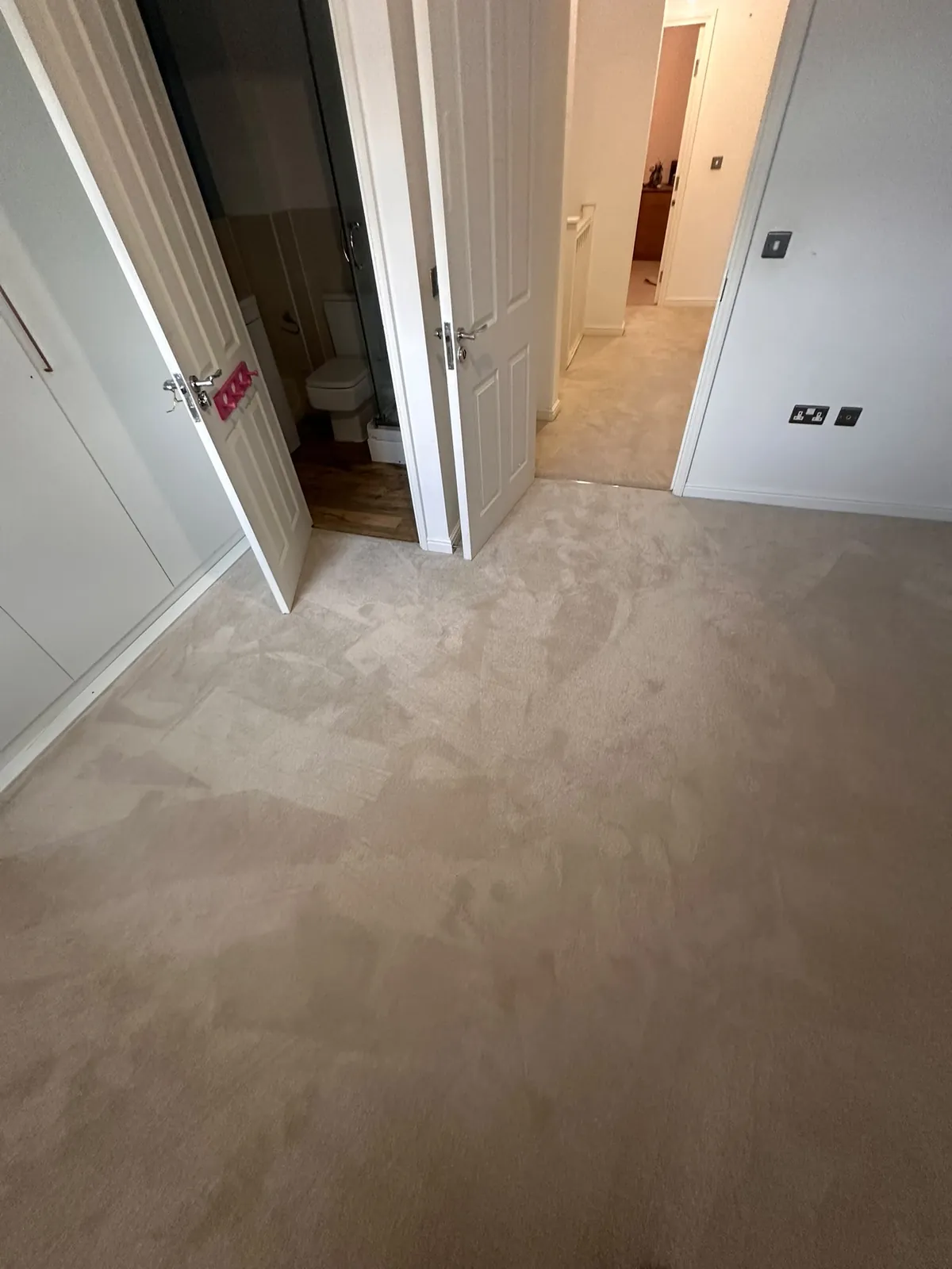 Landing carpet outside bathroom and bedrooms shown before uplift — Bromley BR1