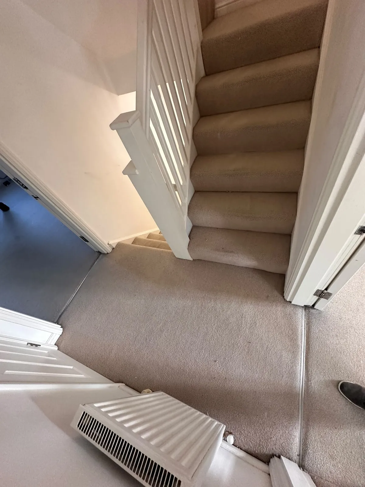 Further staircase view showing worn carpet pile before uplift — Bromley BR1