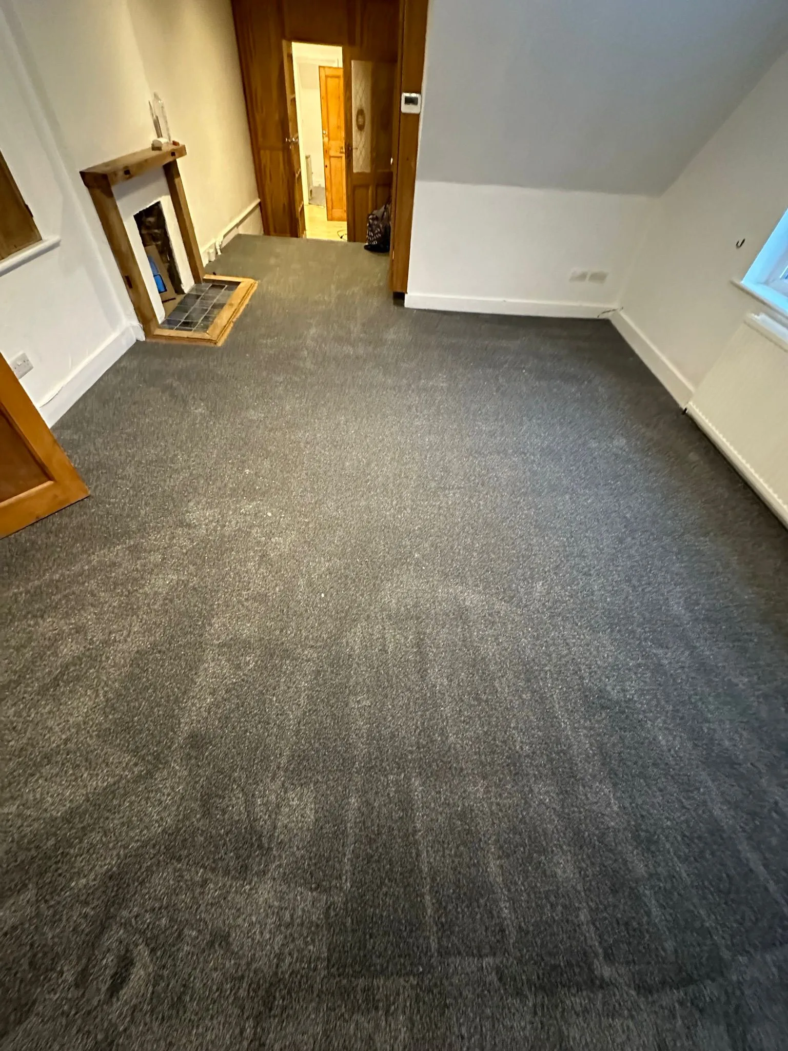 Dark grey carpet fitted in living room