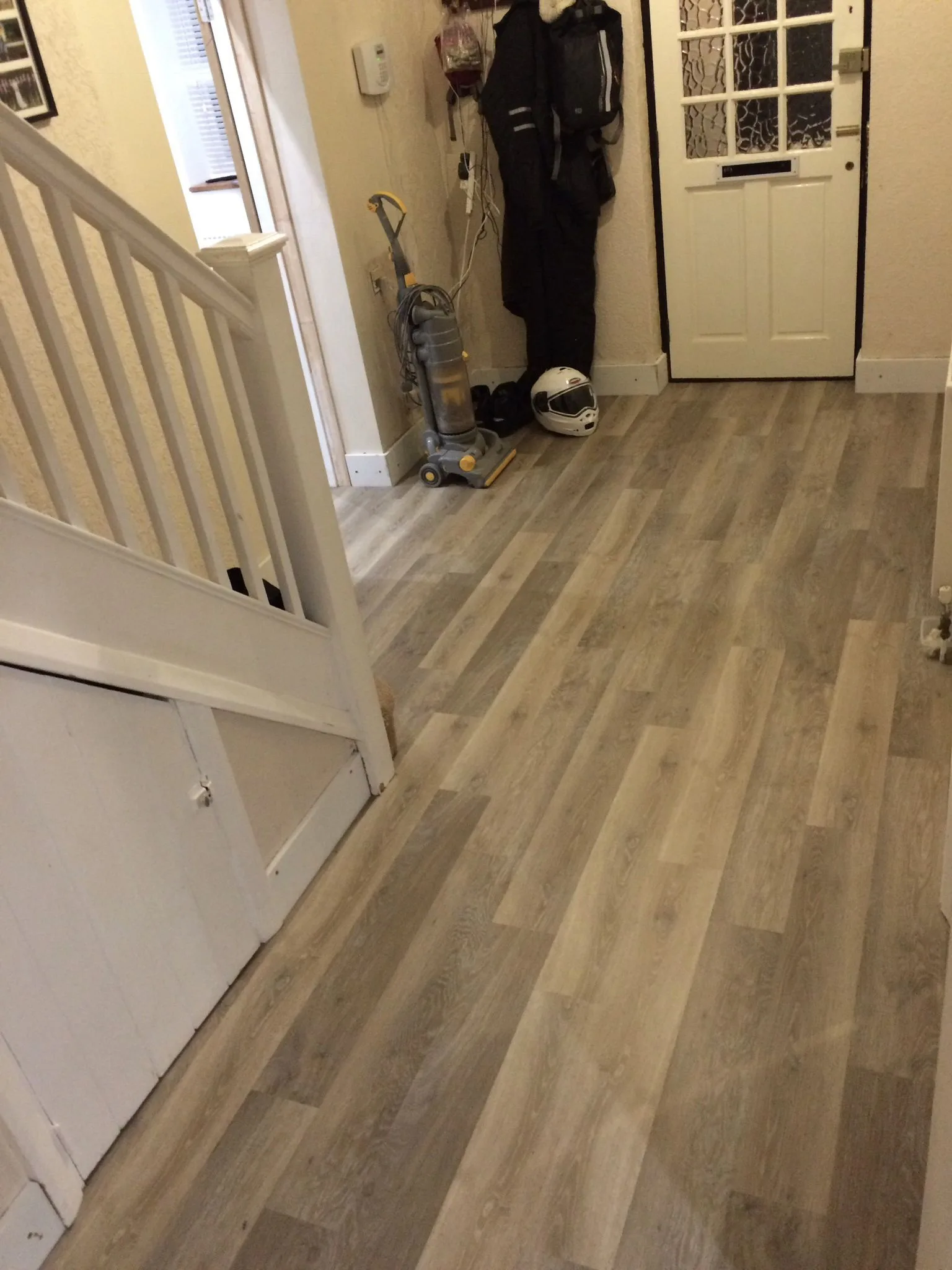 Grey wood effect click LVT in a Rusthall hallway
