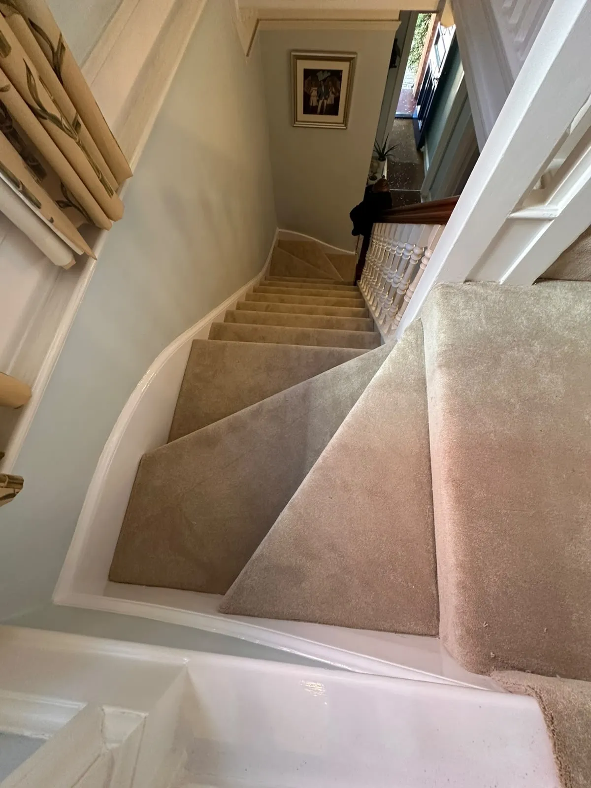 Abingdon Captivation carpet fitted on a winder staircase with white painted spindles seen from the landing, Shirley, Croydon CR0