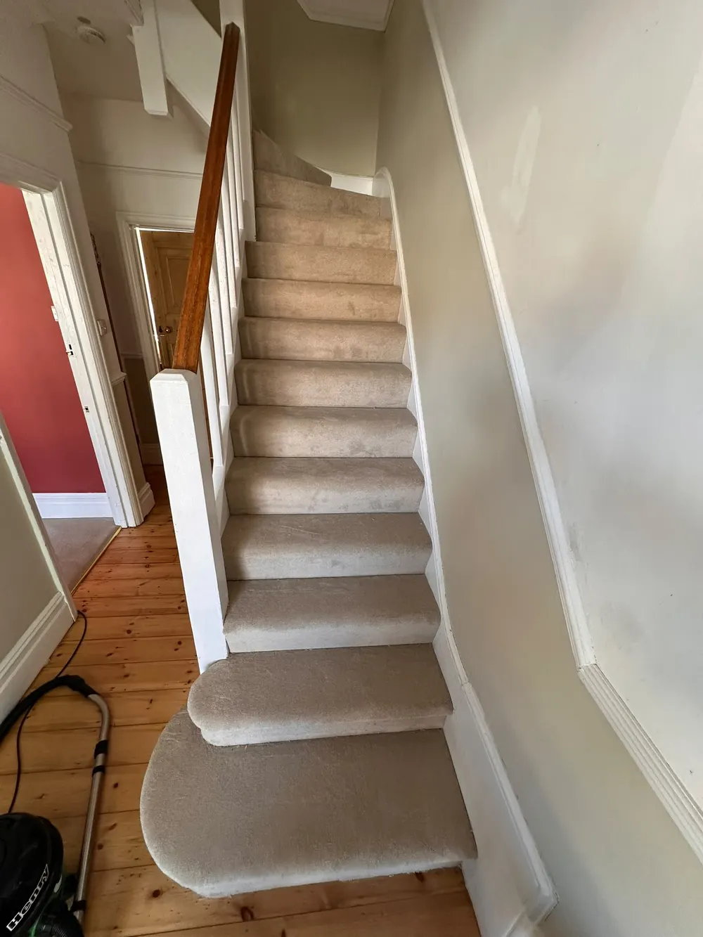 Finished staircase and hallway with new Fulham Leather carpet fitted by South Croydon carpet fitters
