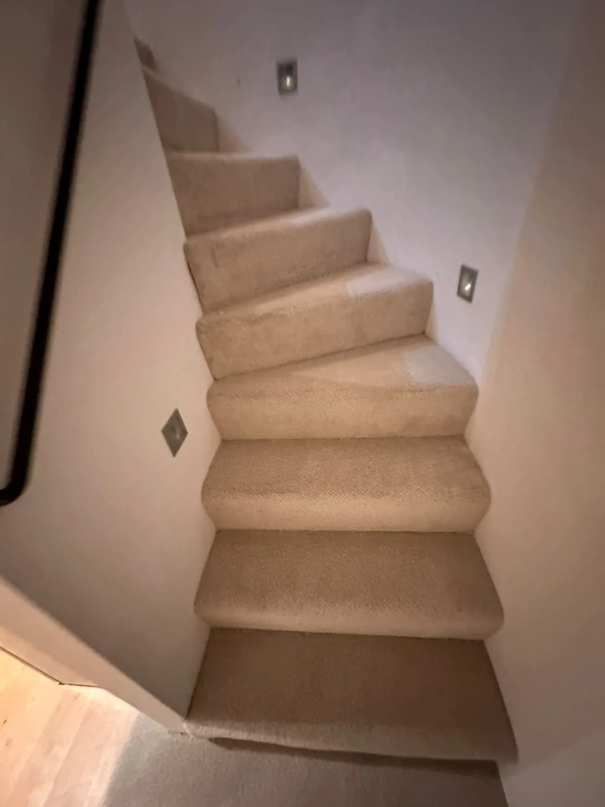 New Victoria Carpets Natural Impressions carpet fitted on a narrow winder staircase with recessed wall lights, Tower Bridge, Southwark SE1